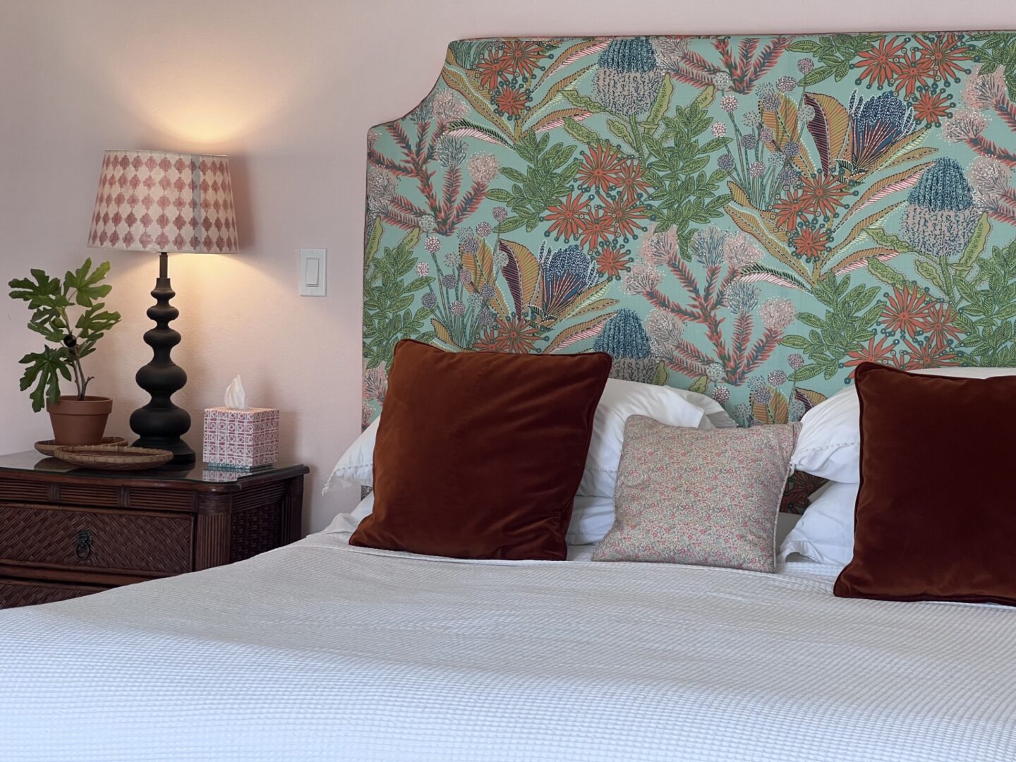 Bedroom with floral headboard and lamp